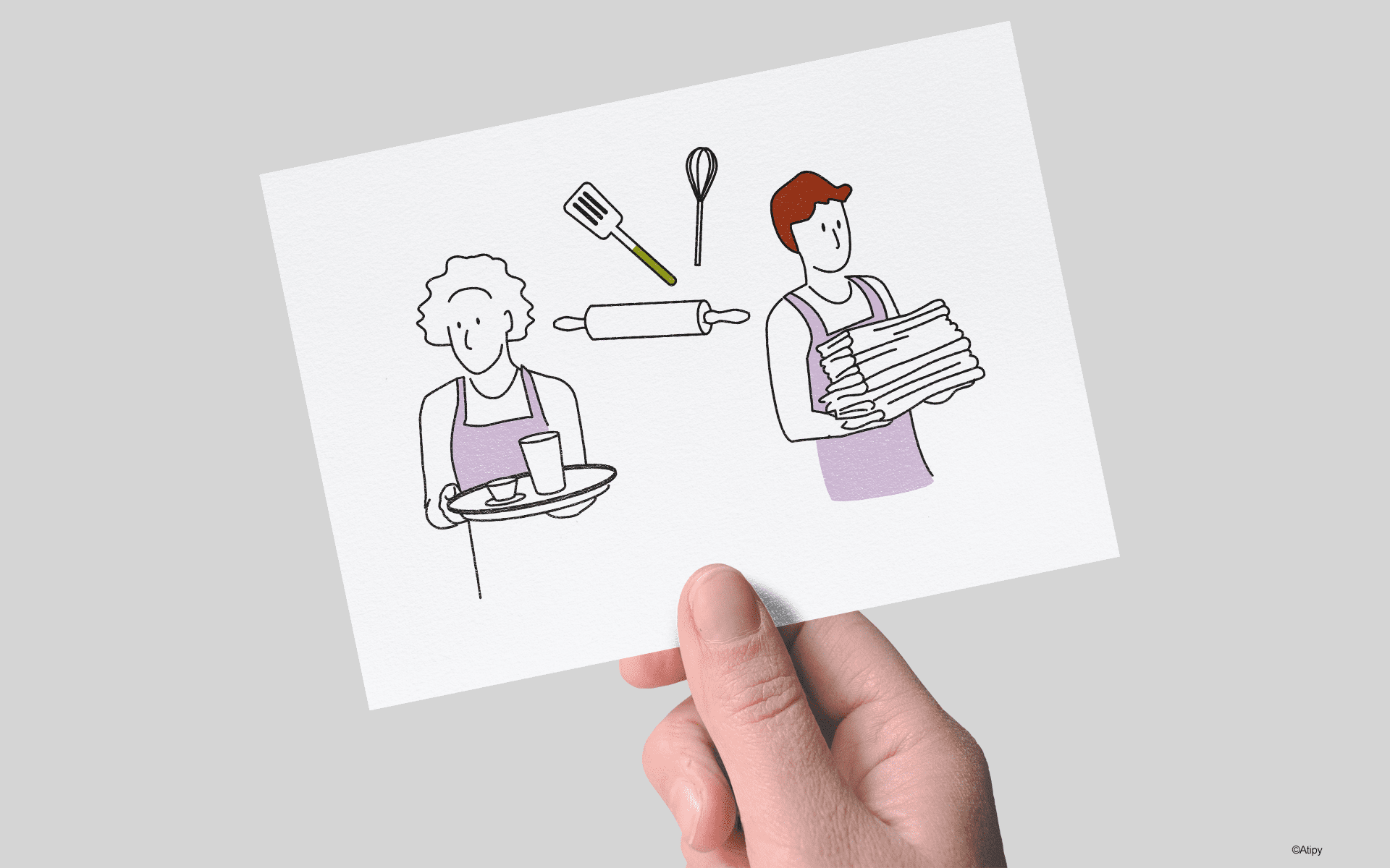 Carte tenue en main avec dessins de deux personnes en tablier, plateau, linge plié et ustensiles de cuisine